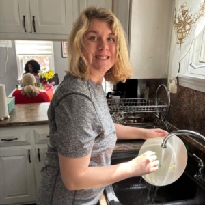 a woman doing dishes at home